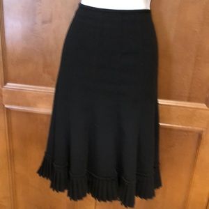 Beautiful lined, paneled skirt with flourish ruffle hemline.